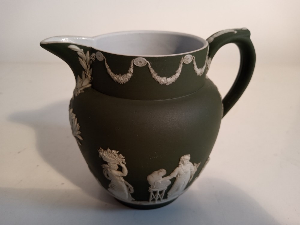 A late nineteenth-century three-piece olive green Wedgwood jasperware bachelor tea set adorned with white Neoclassical relief figures and foliage. View IV