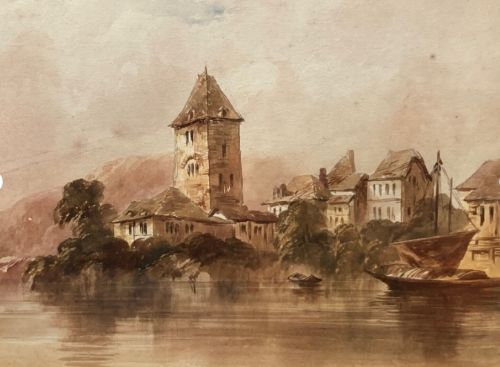 fig 1. An early 19th-century framed watercolour landscape painting depicting architectural buildings and a central stone tower beside a lake, enclosed in a gilded frame.