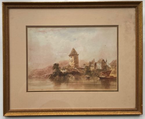 fig 2. An early 19th-century framed watercolour landscape painting depicting architectural buildings and a central stone tower beside a lake, enclosed in a gilded frame.