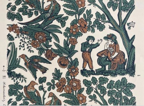 fig 1. A hand-printed wallpaper sample featuring birds, flora, and pastoral figures mounted within a forest green frame.