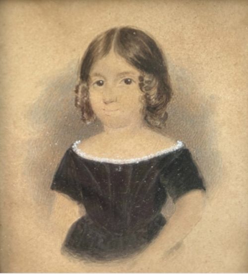 fig 4. An early nineteenth-century watercolour portrait miniature of a young girl with brown hair, presented in a square ebonised frame with a gilt inner slip and top brass hanger.