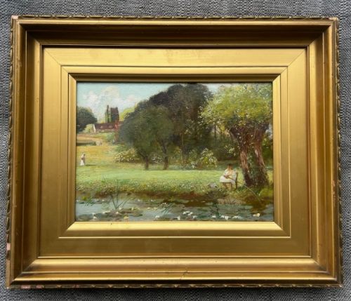 fig 1. An early 20th-century oil painting on wood panel depicting a seated figure fishing beside a lily-dappled riverbank framed by leafy trees and distant rural cottages.