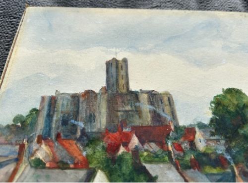 An early 20th-century watercolour landscape painting portraying Warkworth Castle rising above cottages alongside a calm river with a small boat. View VI