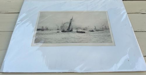 A monochrome etching depicting sailing barges, steamships, and tugboats on the River Thames at Blackwall Reach, pencil-signed by artist William Lionel Wyllie in the lower left margin. View X