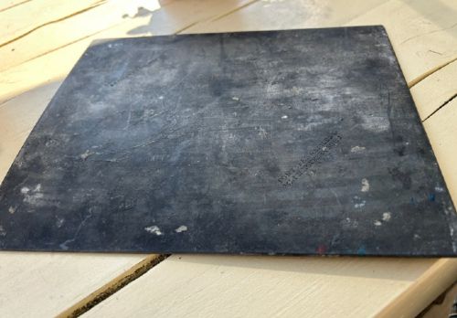 An early nineteenth-century rectangular dark metal printing plate depicting an etched historical scene of figures near a stone monument in Halifax. View V