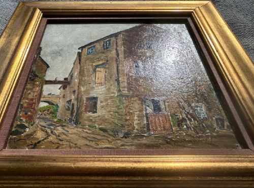 An early twentieth-century oil painting on panel depicting a stone mill building, framed within a fabric slip and a moulded giltwood frame. View IX