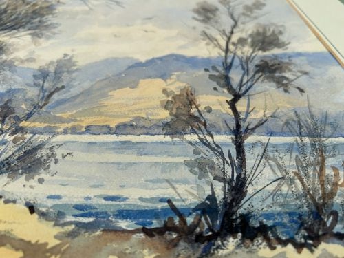 An original landscape watercolour painting depicting bare winter trees on a lake shoreline with distant Cumbrian mountains rendered in muted blue, grey, and brown tones. View V