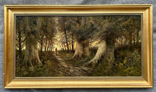 fig 1. A late nineteenth-century horizontal oil painting depicting a solitary figure walking along a sunlit woodland path framed by large ancient trees within a gold leaf frame.