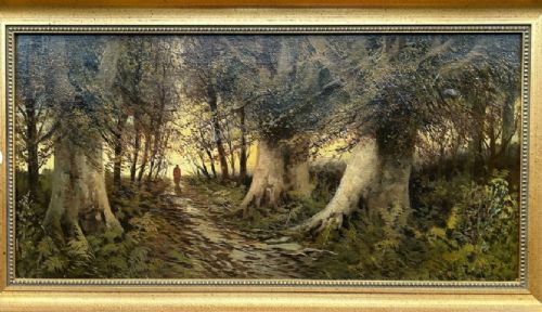 A late nineteenth-century horizontal oil painting depicting a solitary figure walking along a sunlit woodland path framed by large ancient trees within a gold leaf frame. View VIII