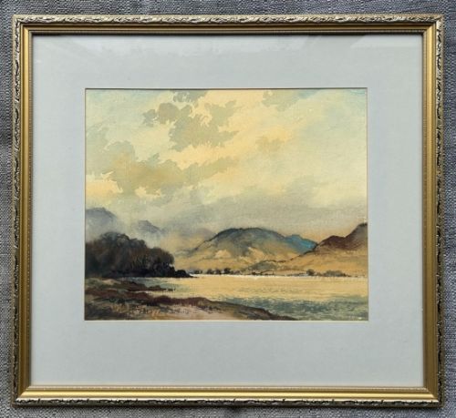 fig 1. A mid-20th-century watercolour painting depicting a lake surrounded by mountains under a soft clouded sky.