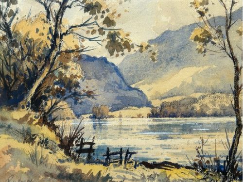 A mid-20th-century watercolour landscape painting depicting a Cumbrian lake framed by foreground trees and distant mountains in tones of blue and ochre. View VI