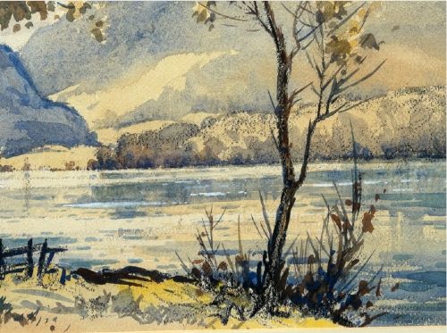 A mid-20th-century watercolour landscape painting depicting a Cumbrian lake framed by foreground trees and distant mountains in tones of blue and ochre. View VII