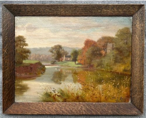fig 2. A late 19th-century oil painting on canvas depicting a tranquil autumn river landscape framed in a wide, dark oak wood frame.