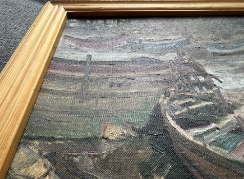 A mid-century oil painting on board depicting wooden barges and boats resting on a muddy riverbed at low tide. View VIII