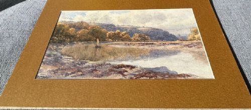fig 3. A late 19th-century watercolour painting depicting a river reflection bordered by autumnal trees and rolling hills under a cloudy sky.