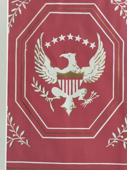 Crimson red hand-printed wallpaper panel featuring white and gold American eagle motifs within octagonal panels, laurel swags, and geometric borders. View VII