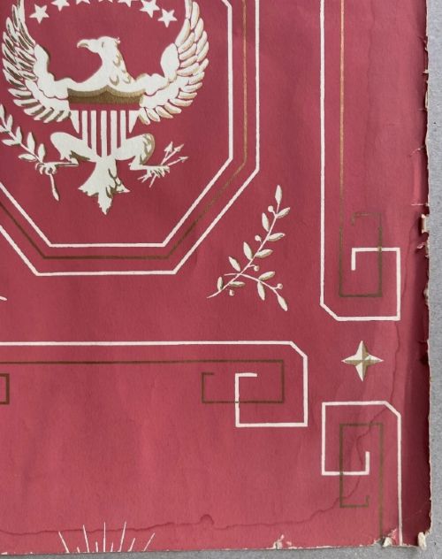 Crimson red hand-printed wallpaper panel featuring white and gold American eagle motifs within octagonal panels, laurel swags, and geometric borders. View XI