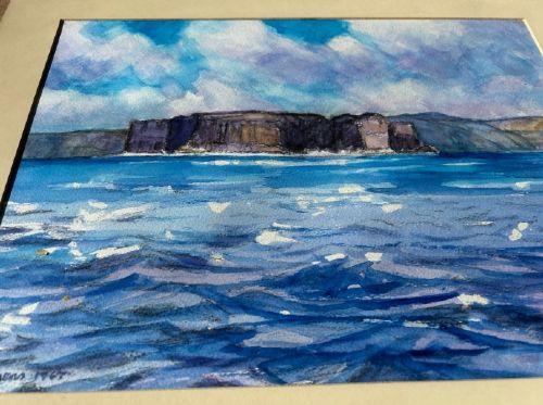 A 1967 vintage watercolour painting depicting the rocky coastal cliffs of Staffa surrounded by blue sea under a cloudy sky. View VI