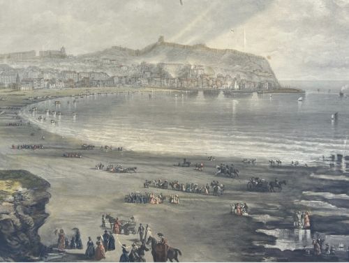 An 1890 monochrome autotype print depicting Victorian figures gathered on a cliff overlooking Scarborough beach and coastal bay. View XII