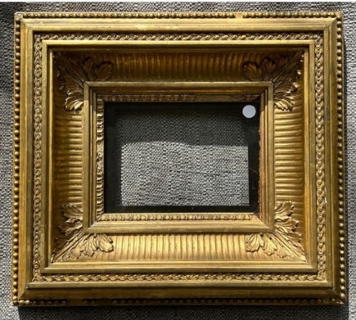 fig 1. A square, deep-profile antique giltwood picture frame featuring fluted channel moulding and carved acanthus leaf corner ornaments.