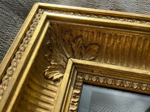 fig 3. A square, deep-profile antique giltwood picture frame featuring fluted channel moulding and carved acanthus leaf corner ornaments.
