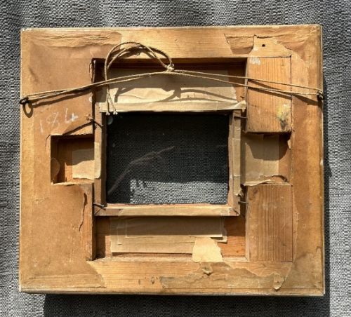 A square, deep-profile antique giltwood picture frame featuring fluted channel moulding and carved acanthus leaf corner ornaments. View VII