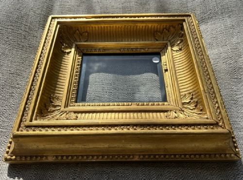 fig 2. An antique square giltwood picture frame featuring fluted hollow moulding, acanthus leaf corner ornaments, and beaded inner borders.