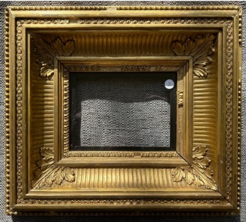 An antique square giltwood picture frame featuring fluted hollow moulding, acanthus leaf corner ornaments, and beaded inner borders. View VII