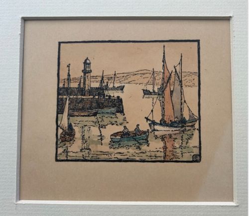 fig 1. An early 20th-century miniature woodblock print depicting St Ives harbour with a lighthouse, sailing vessels, a rowboat, and coastal hills printed in ink on beige paper.