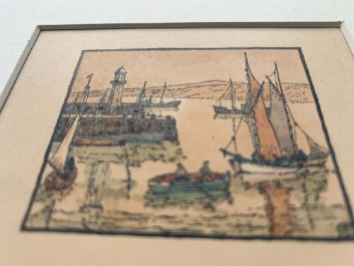 An early 20th-century miniature woodblock print depicting St Ives harbour with a lighthouse, sailing vessels, a rowboat, and coastal hills printed in ink on beige paper. View VIII