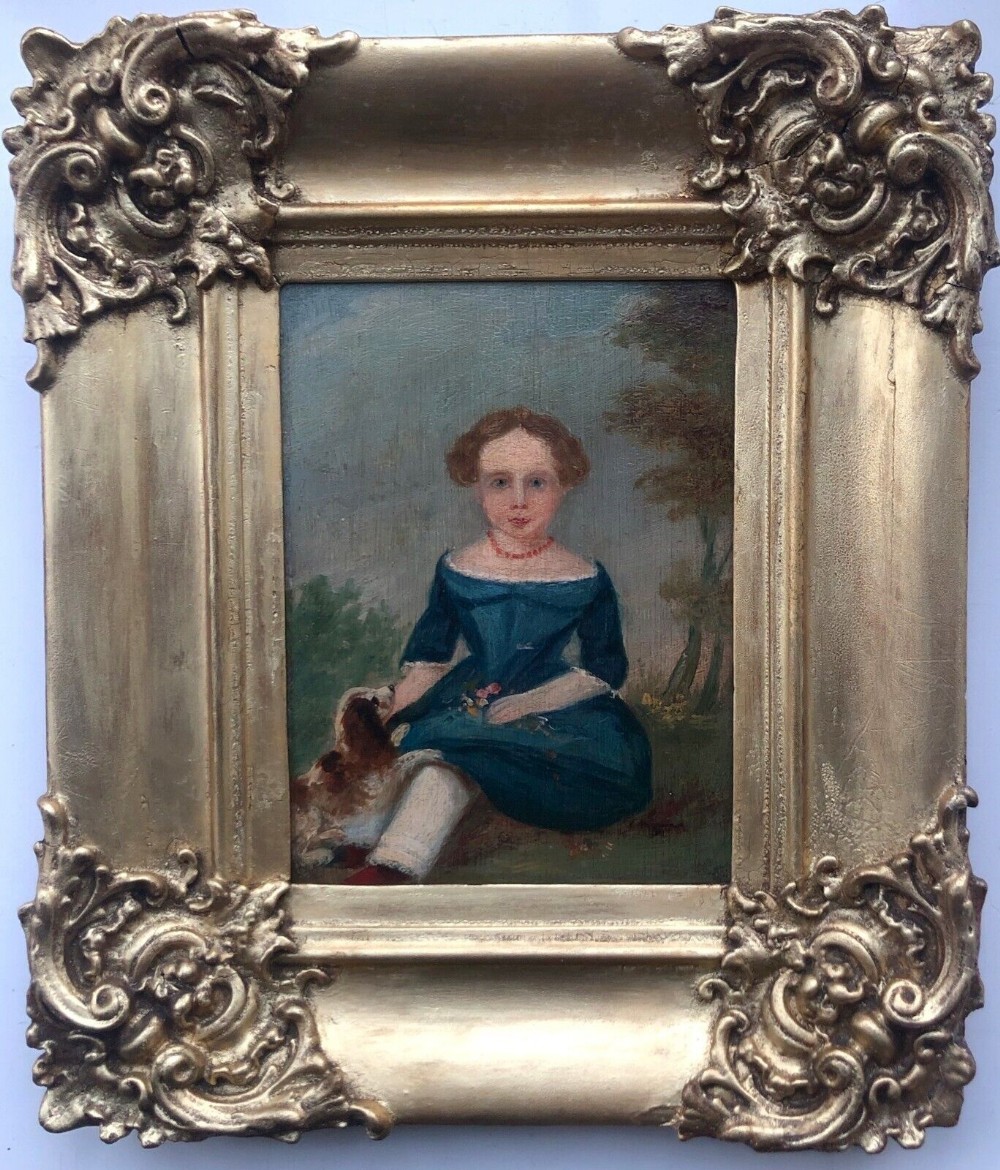 Original early 19th Century Oil Painting on Wood Panel Girl Seated with a Cavalier Spaniel in a Landscape with Ornate Frame