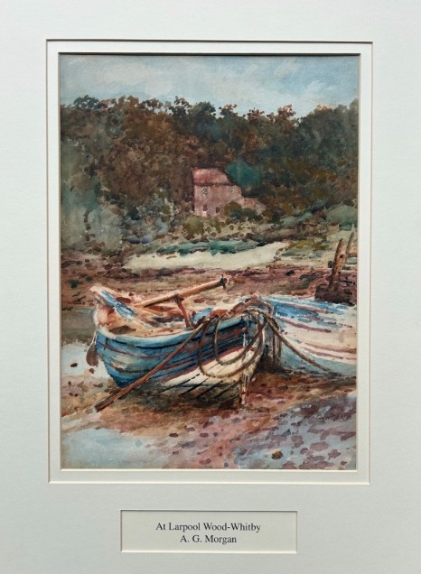 An antique watercolour painting depicting wooden boats along the River Esk near Whitby, presented in a gold gilt frame with a white mount. View VII