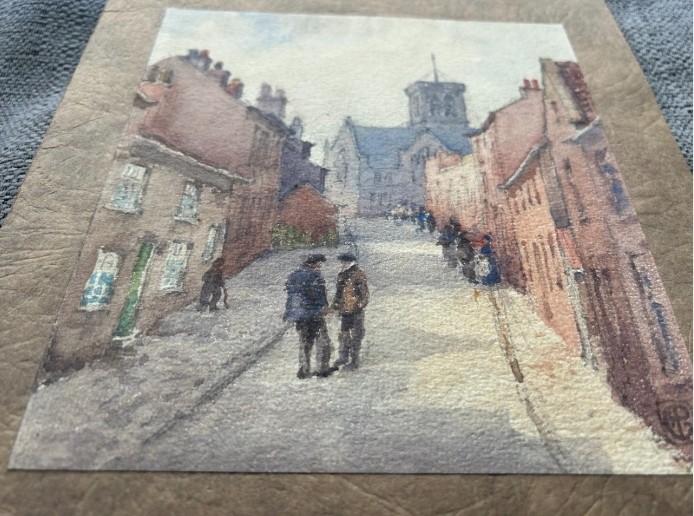 An antique watercolour painting depicting figures on a sloping street flanked by brick buildings leading towards a church tower. View VIII