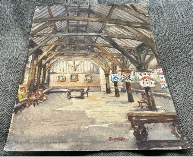 An early 20th-century original watercolour painting depicting the timber-framed interior roof structure and heraldic banners of the Merchant Adventurers Hall in York, signed by George Pennington. View VII