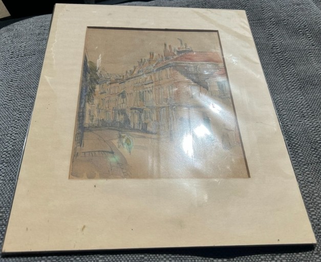 An architectural watercolour painting on beige paper depicting a curving street lined with multi-storey brick and timber buildings, rendered in muted ochre and grey tones. View XI