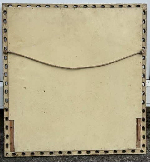 A square framed needlework panel displaying a central floral arrangement in red, blue, and yellow on a cream stitched background inside a carved gold frame. View IX
