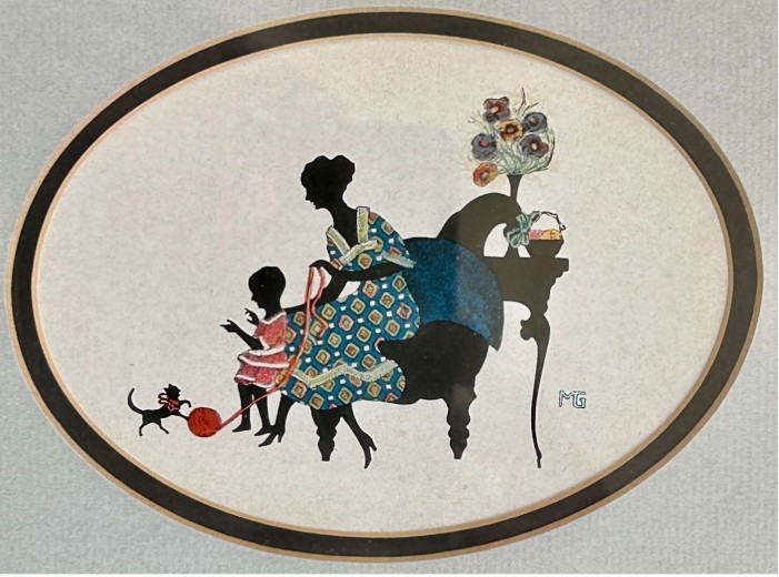 A framed 1920s Art Deco silhouette artwork displaying a mother and child scene inside an oval aperture set within a wide burr walnut frame. View II