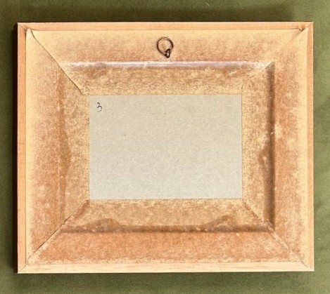 A framed 1920s Art Deco silhouette artwork displaying a mother and child scene inside an oval aperture set within a wide burr walnut frame. View V