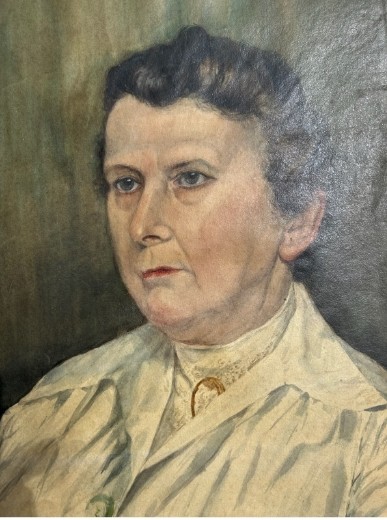 An original 1921 gouache and watercolour portrait painting of a woman in a cream blouse set against a muted green background. View II