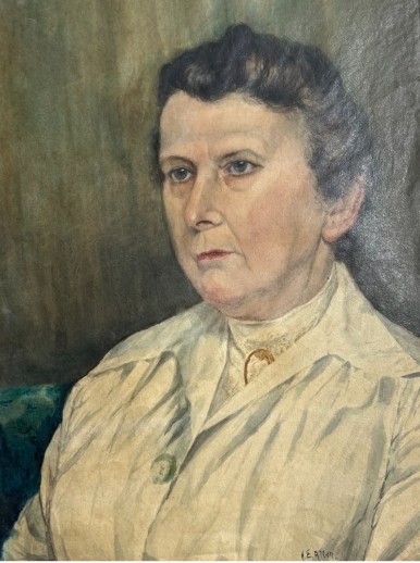 An original 1921 gouache and watercolour portrait painting of a woman in a cream blouse set against a muted green background. View VI