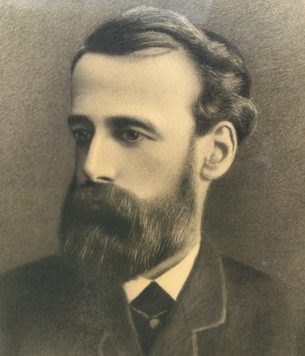 A framed late 19th-century charcoal portrait depicting a bearded gentleman in formal attire. View V