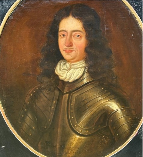 A seventeenth-century oil painting on canvas depicting a gentleman in dark plate armour, set within an oval spandrel inside a decorative giltwood frame. View II