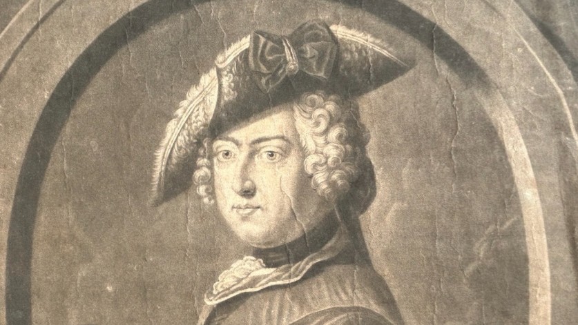An 18th-century monochrome mezzotint print depicting a bust portrait of Frederick King of Prussia set within a stone oval frame. View IX