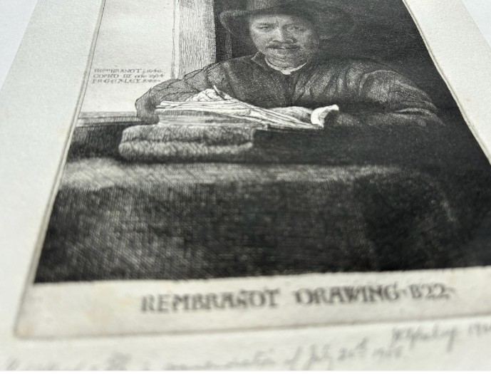A monochrome etching depicting a man in a wide-brimmed hat seated at a window writing on a stack of paper, signed along the lower border. View VII