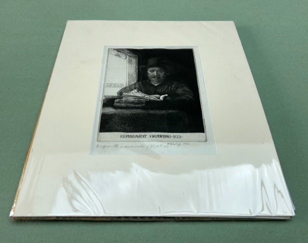 A monochrome etching depicting a man in a wide-brimmed hat seated at a window writing on a stack of paper, signed along the lower border. View XV