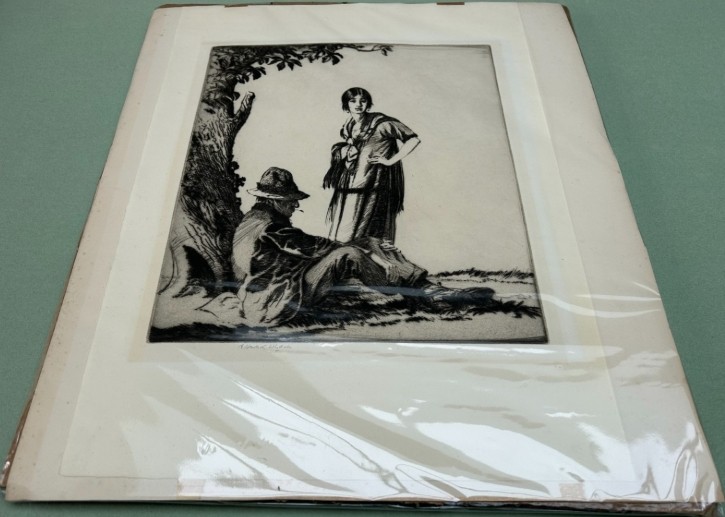 A monochrome drypoint etching depicting a seated man in a hat and a standing woman beneath a leafy tree trunk. View XIII