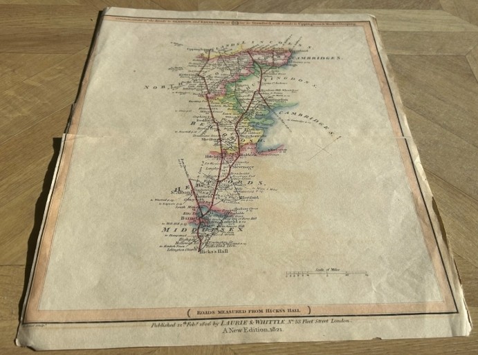 An 1821 engraved British road map featuring hand-coloured county outlines detailing travel routes from London to Stamford. View V