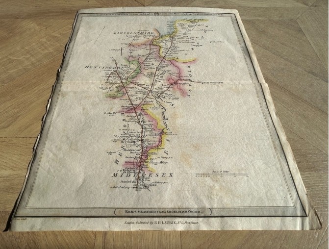 A hand-coloured Georgian engraved road map showing routes through Cambridgeshire and Norfolk printed on cream paper. View V