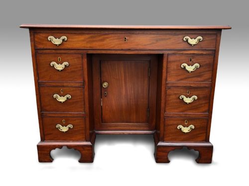 a mid 18th century mahogany kneehole desk - CATEGORY: ANTIQUE DESKS - DATED GEORGIAN