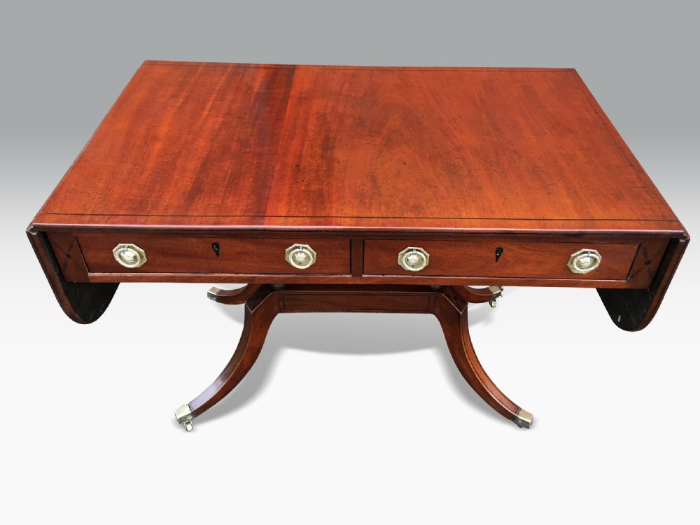 A FINE REGENCY MAHOGANY & EBONY INLAID SOFA TABLE View II